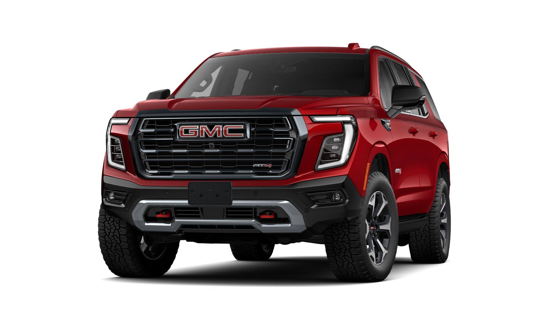 2026 GMC Yukon AT4 in Volcanic Red Tintcoat — front three-quarter view